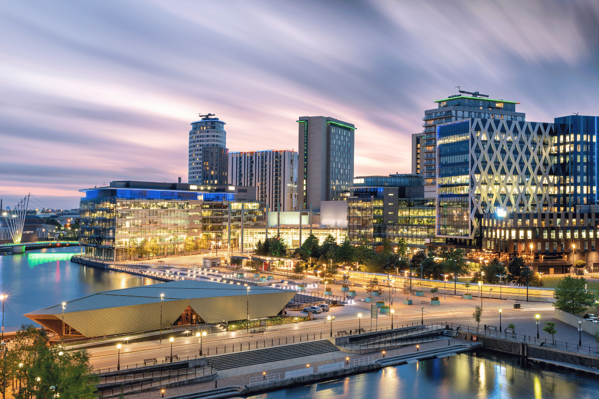 UK office buildings with text overlay: UK Commercial Property Market 2026 — Spaces to Places